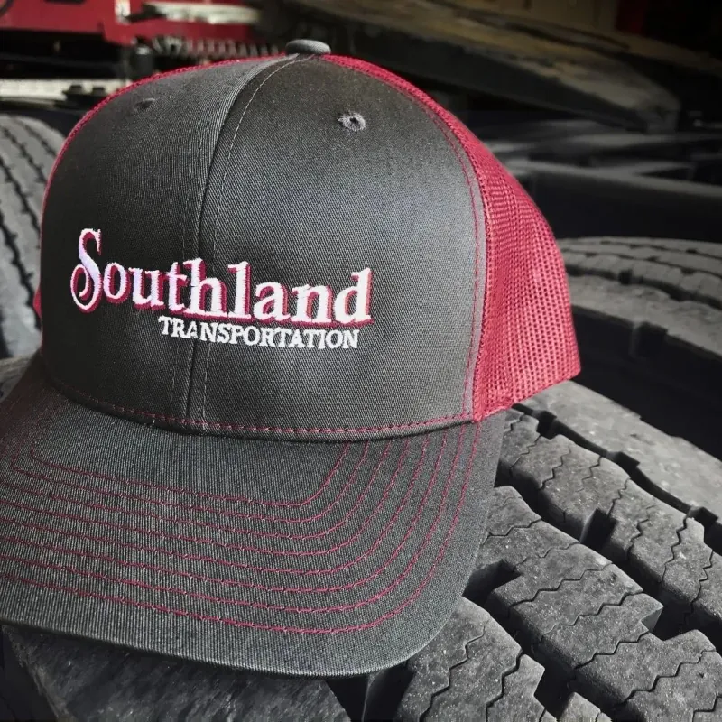 Southland Transportation hat sits on tire in diesel shop